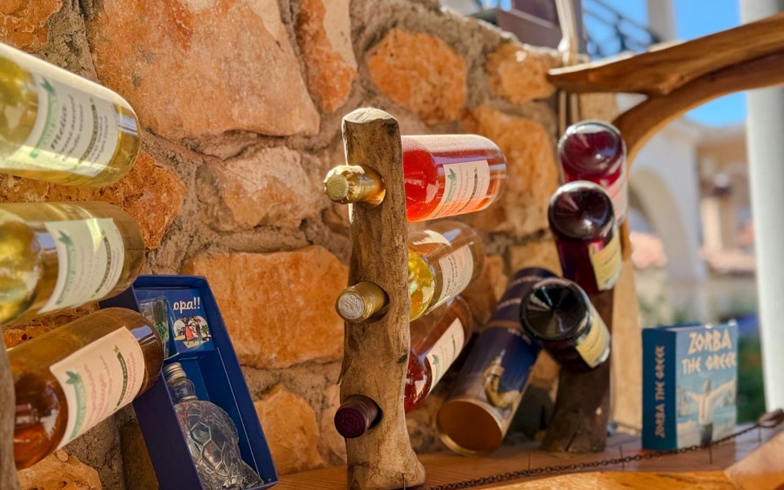 Olive oil bottles displayed on a wooden rack during Zakynthos Glass-Bottom Boat tour.