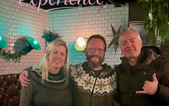 Three people enjoying a private Icelandic dining experience in an exclusive restaurant setting.