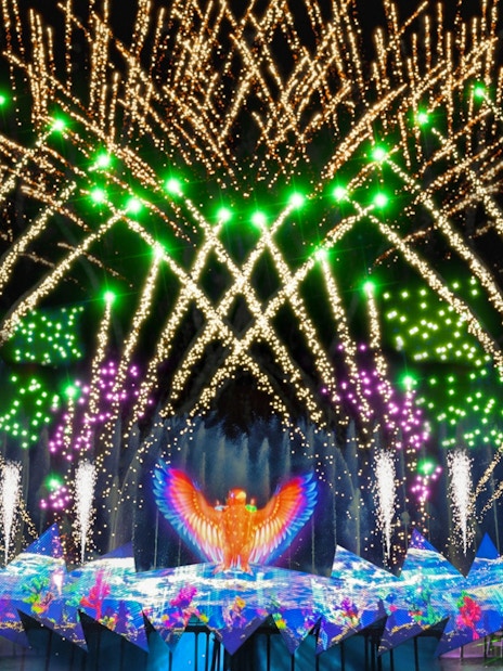 Fireworks display at Wings of Time show, Sentosa Island, with vibrant lights and water effects.