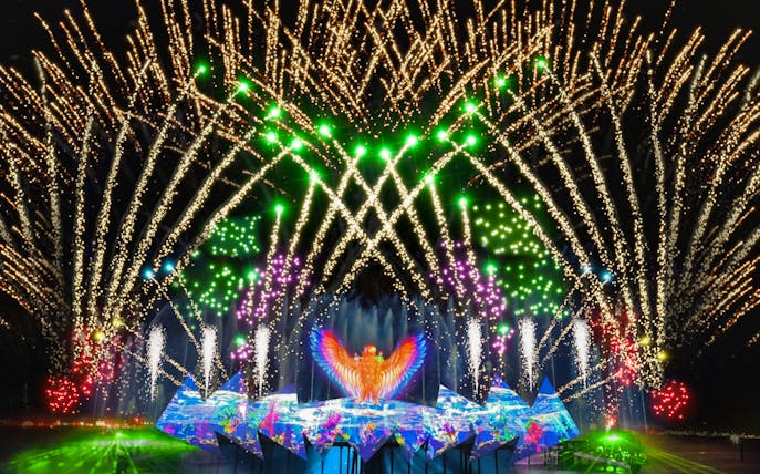 Fireworks display at Wings of Time show, Sentosa Island, with vibrant lights and water effects.