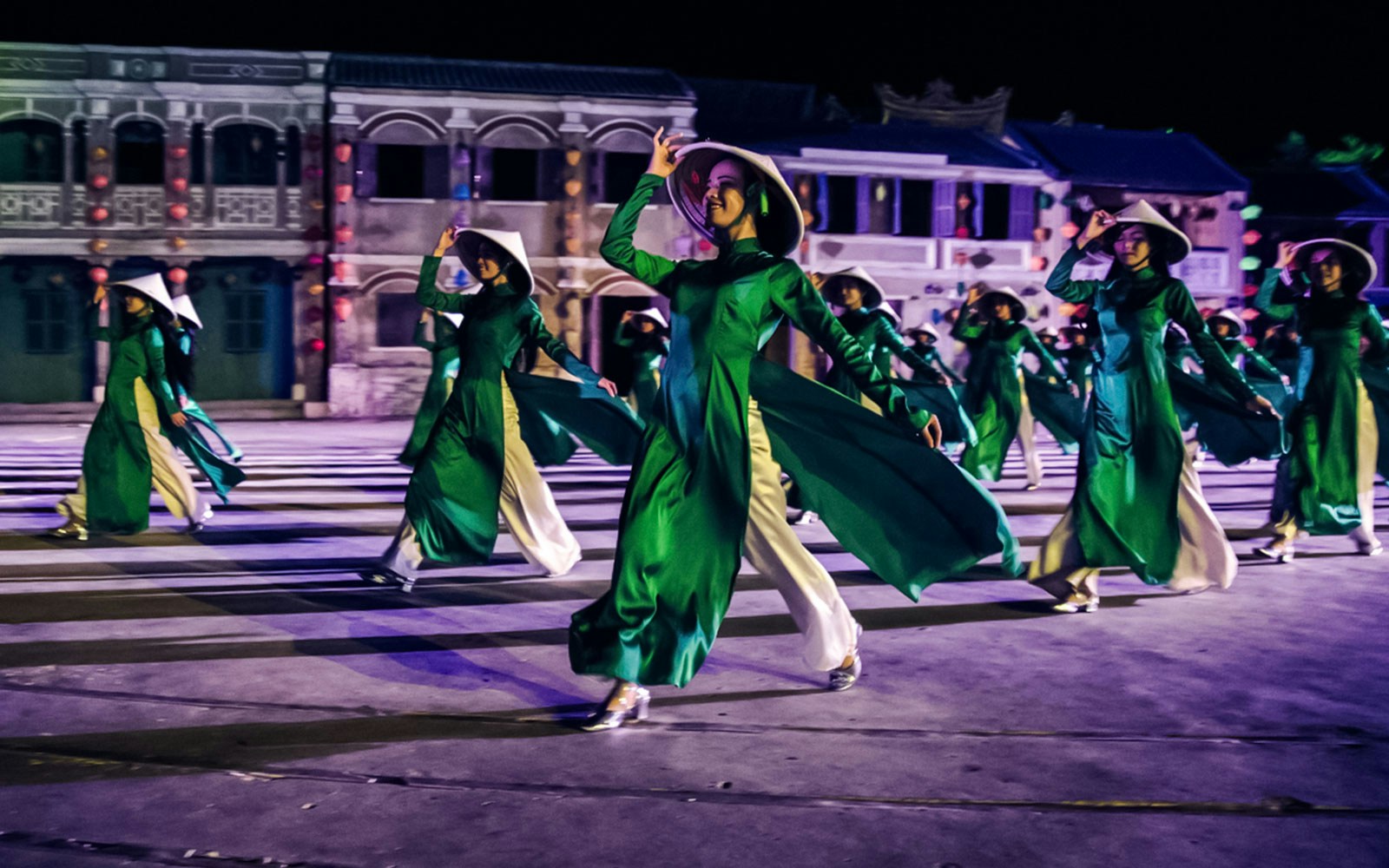Performers in traditional attire at Hoi An Memories Show, Vietnam.