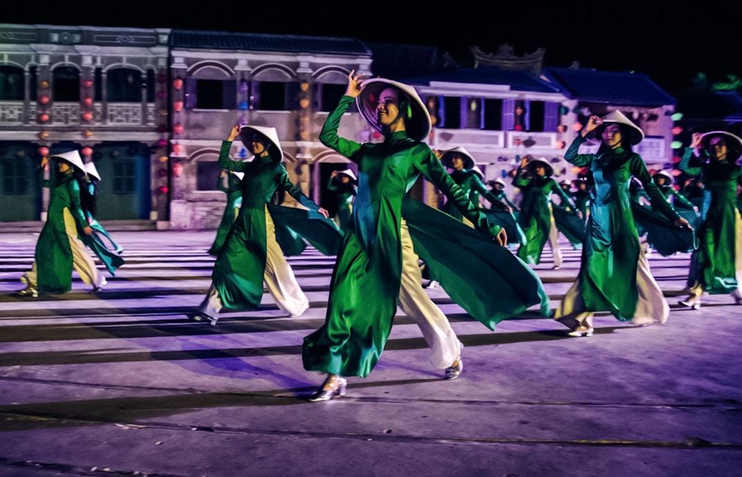 Performers in traditional attire at Hoi An Memories Show, Vietnam.