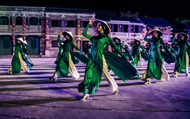 Performers in traditional attire during Hoi An Memories Show, Vietnam.