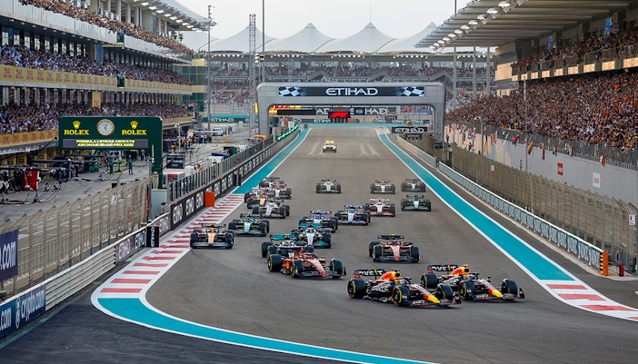 Formula 1 cars racing on Yas Marina Circuit, Abu Dhabi Grand Prix.