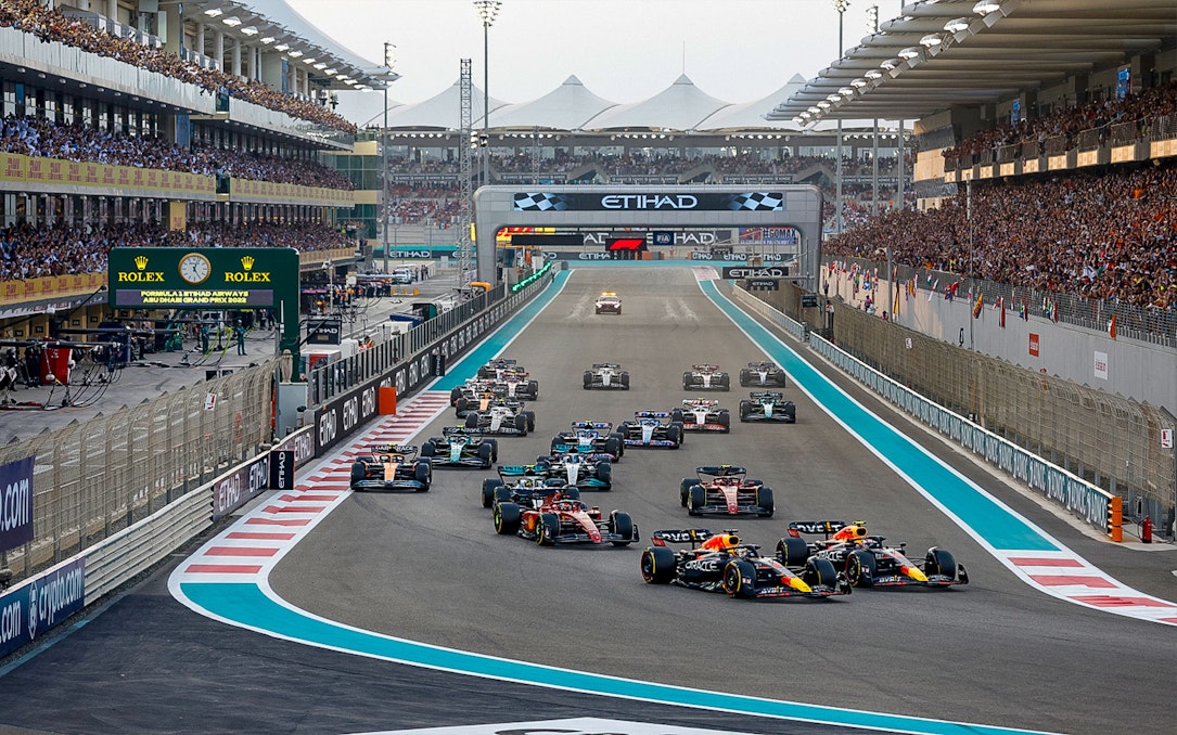Formula 1 cars racing at the Abu Dhabi Grand Prix, Yas Marina Circuit.