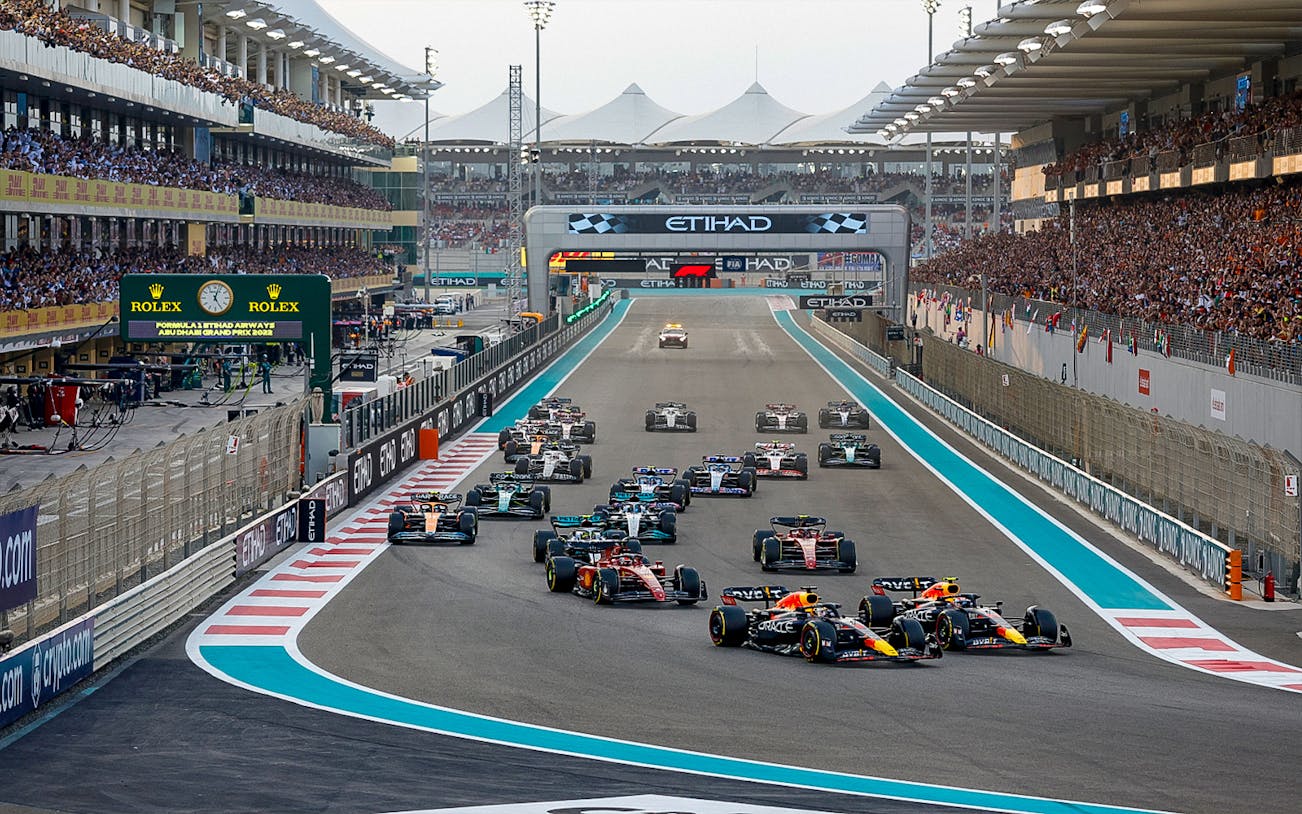 Formula 1 cars racing at the Abu Dhabi Grand Prix, Yas Marina Circuit.