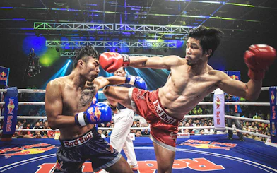 Muay Thai fighters in action at Chiang Mai Boxing Stadium.