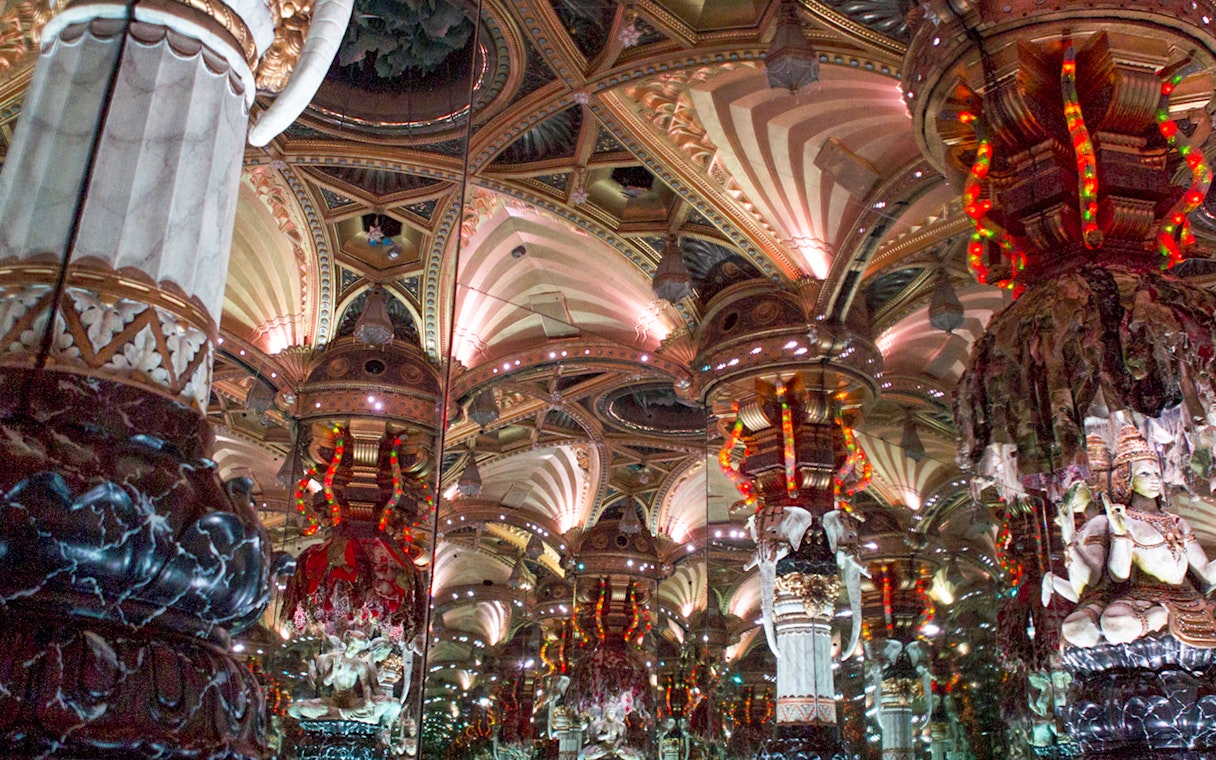 Grévin Wax Museum ornate mirrored ceiling with intricate sculptures.