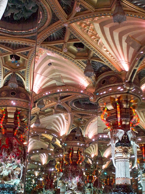 Grévin Wax Museum ornate mirrored ceiling with intricate sculptures.