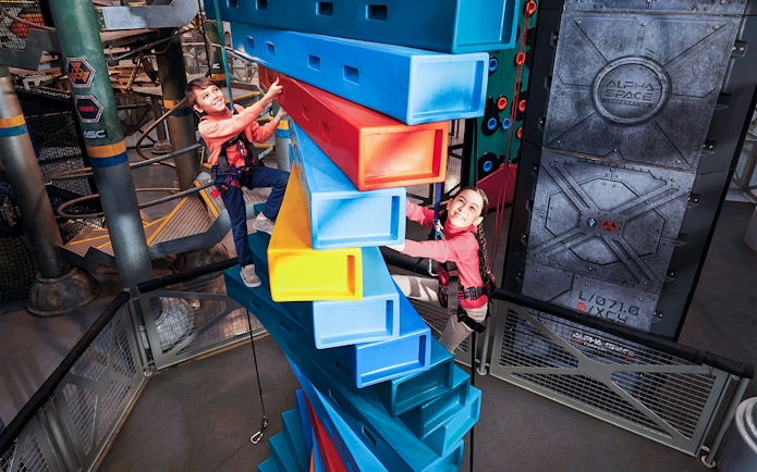 Children climbing colorful blocks at Genting SkyWorld Outdoor Theme Park.