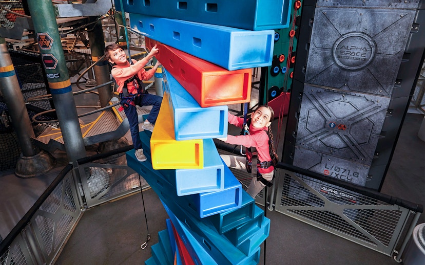 Children climbing colorful blocks at Genting SkyWorld Outdoor Theme Park.
