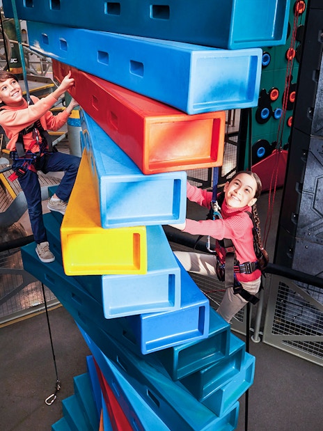 Children climbing colorful blocks at Genting SkyWorld Outdoor Theme Park.
