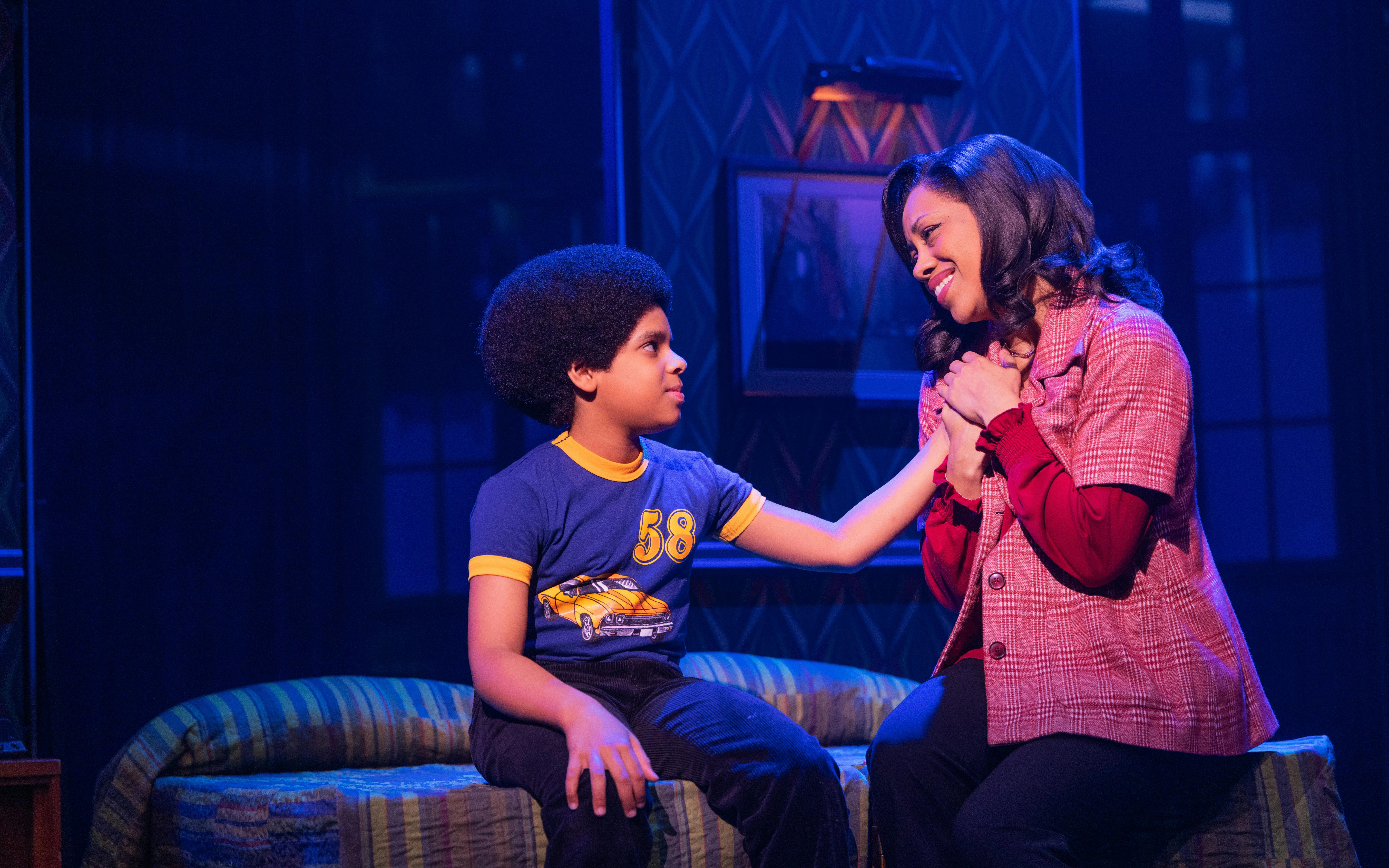 Child actor and woman in heartfelt scene from MJ the Musical on Broadway.