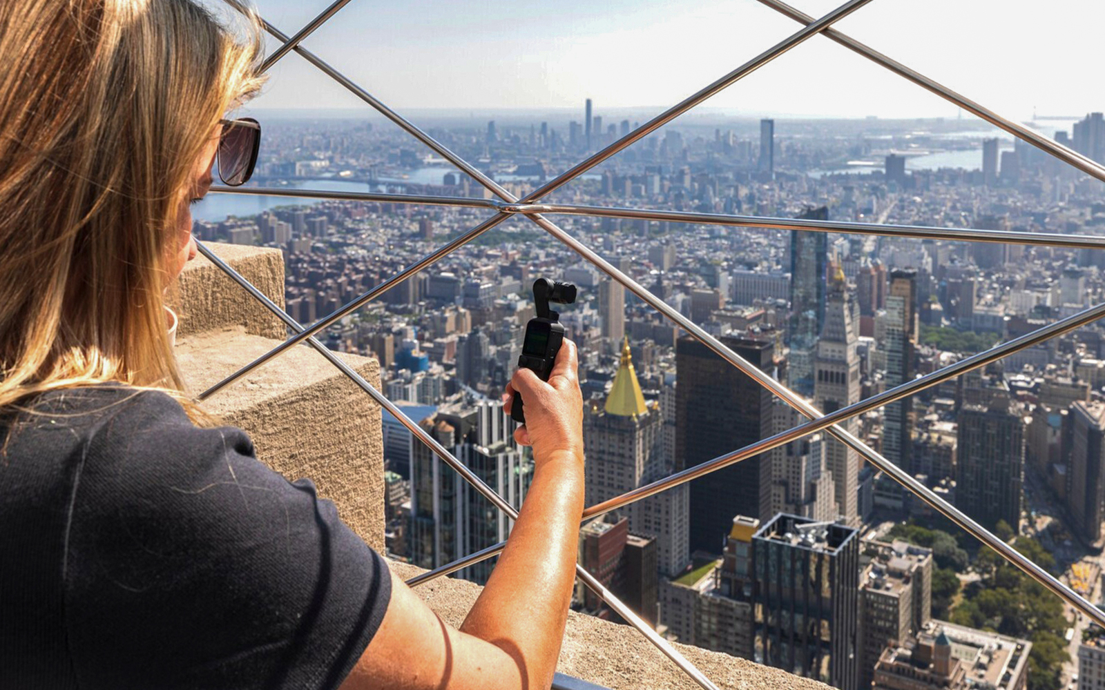 tourist enjoying views from 86th floor of empire state building