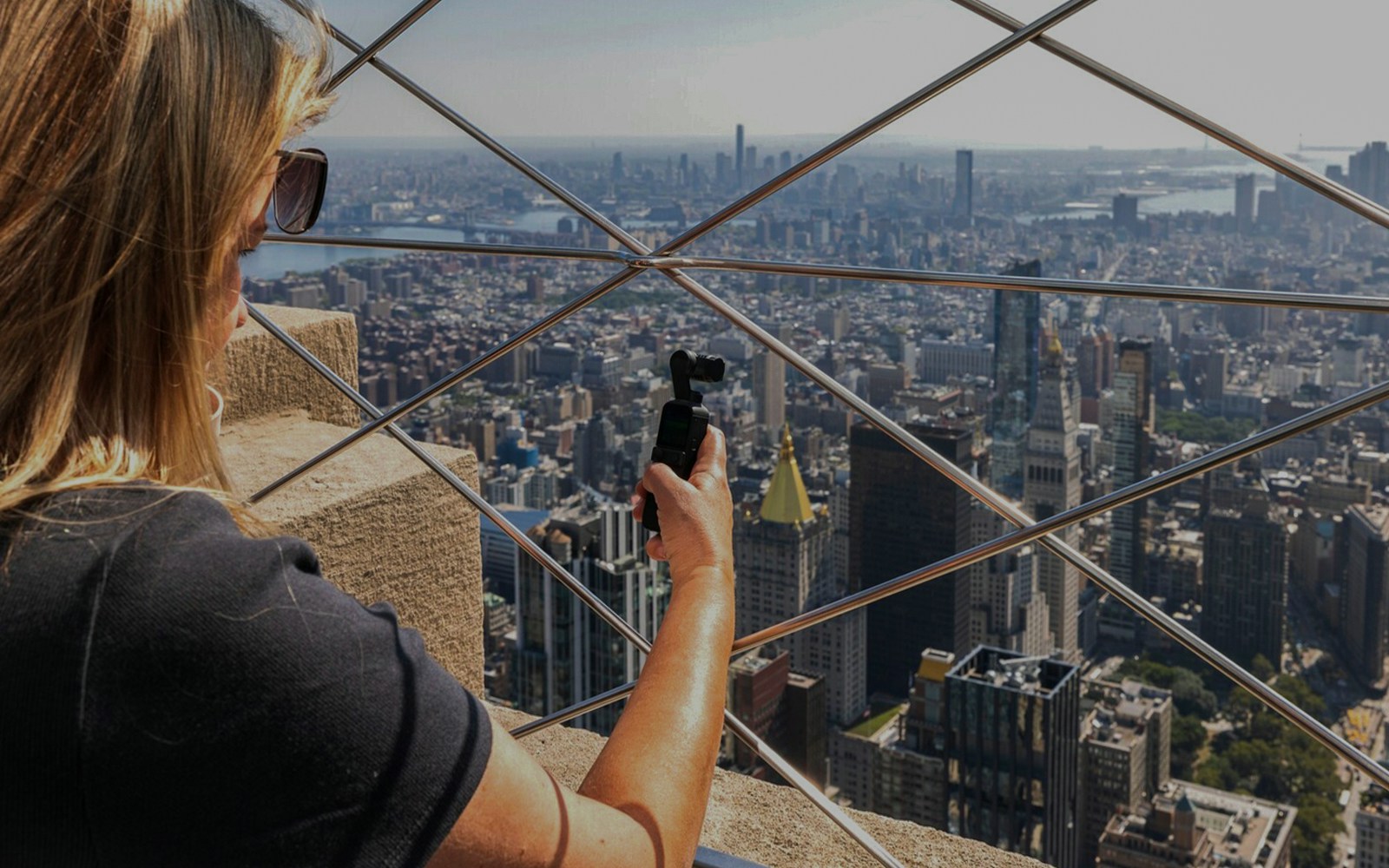 tourist enjoying views from 86th floor of empire state building