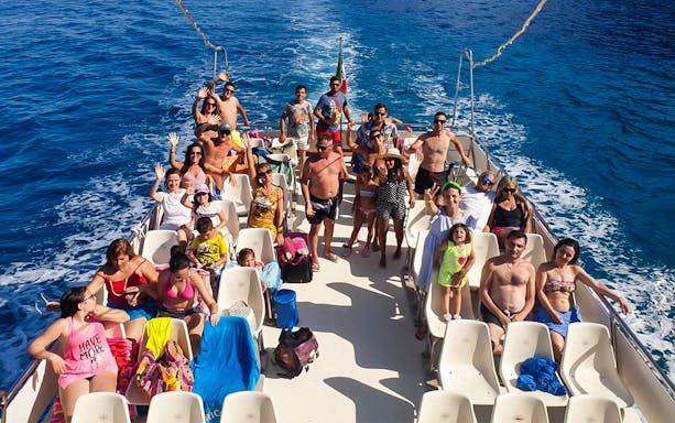 Group enjoying a boat tour on the Gulf of Orosei, departing from Cala Gonone.