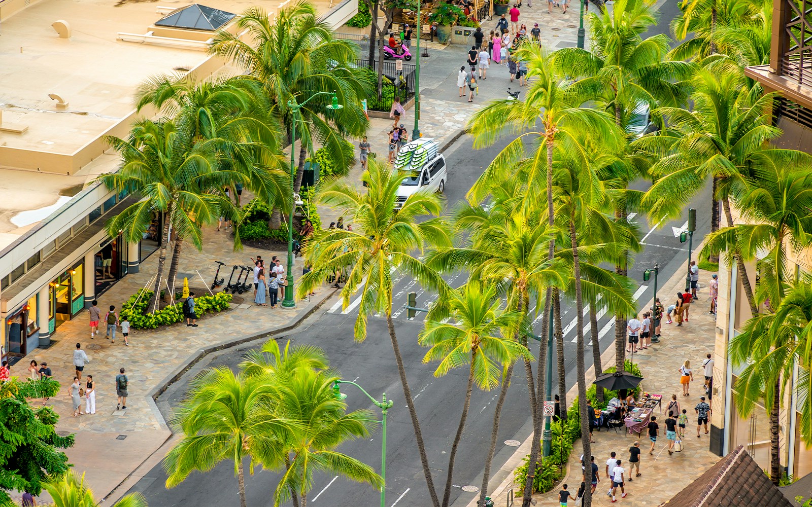 View looking down on Kalakaua Avenue in Waikiki during the evening.