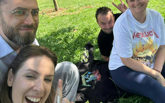 Group enjoying a sunny day on grass during the Jewel of Brașov tour, Schei, Brașov.