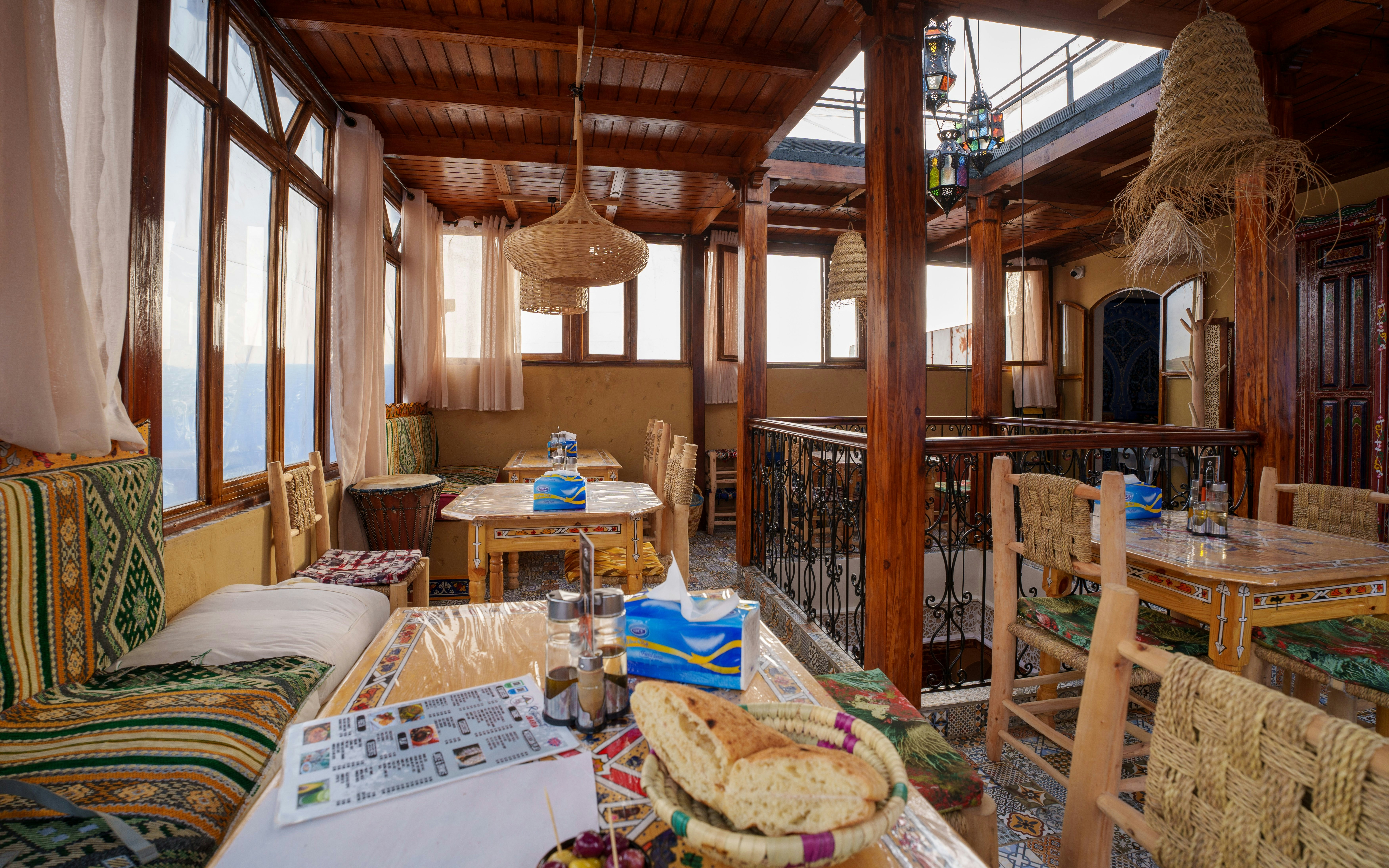 Cafe interior with traditional decor and seating in Chefchaouen, Morocco.
