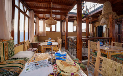 Cafe interior with traditional decor and seating in Chefchaouen, Morocco.