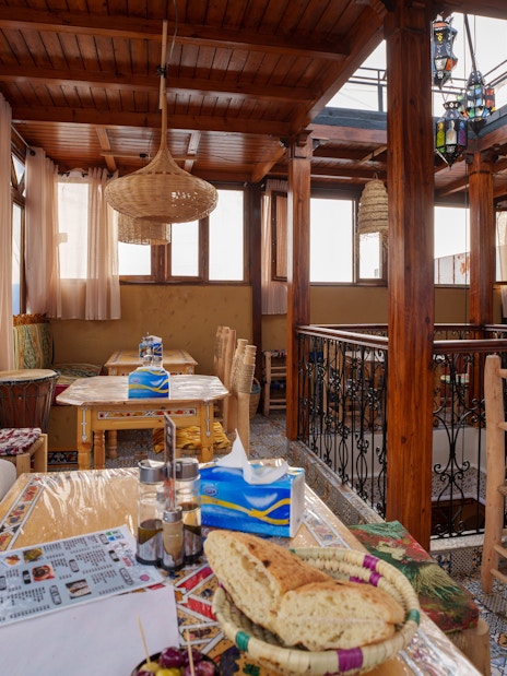 Cafe interior with traditional decor and seating in Chefchaouen, Morocco.