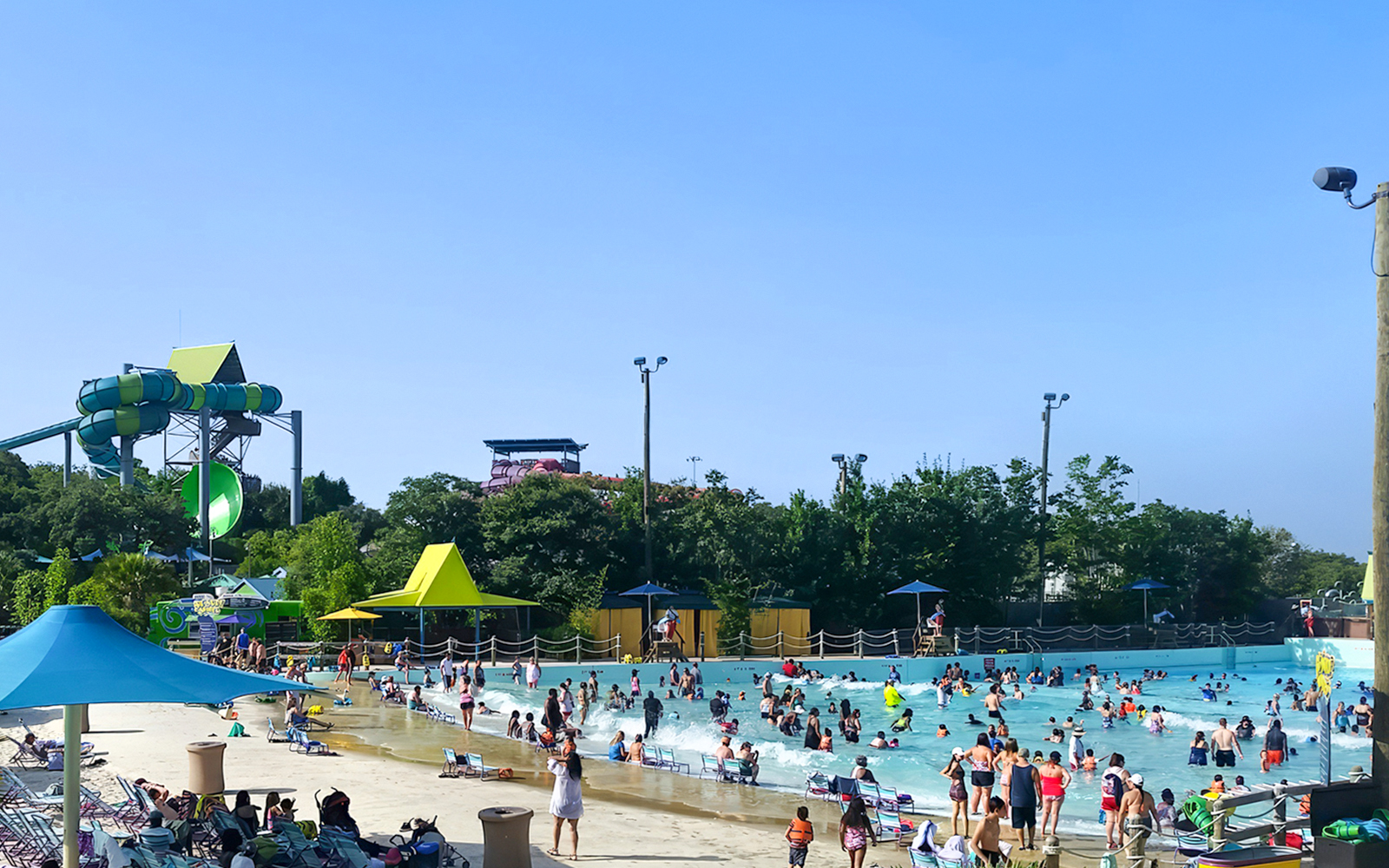 Guests enjoying the wave pool at Aquatica San Antonio, Texas.
