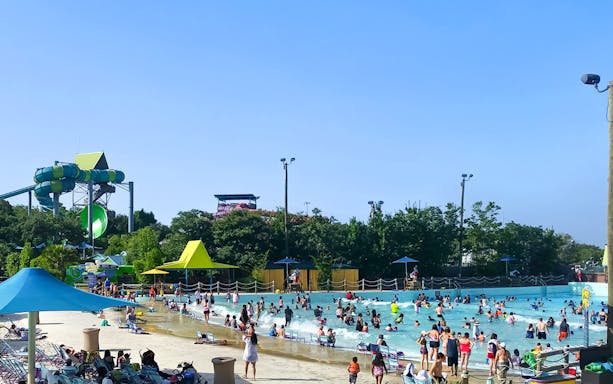 Guests enjoying the wave pool at Aquatica San Antonio, Texas.
