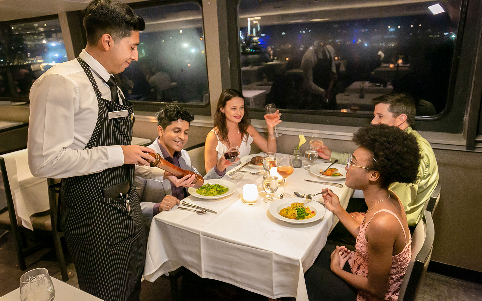 Guests dining on Premier Dinner Cruise, City Cruises, Boston.