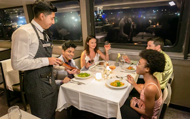 Guests dining on Premier Dinner Cruise, City Cruises, Boston.