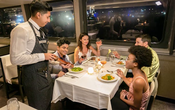 Guests dining on Premier Dinner Cruise, City Cruises, Boston.