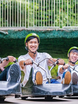 Riders enjoying the Skyline Luge Singapore experience.