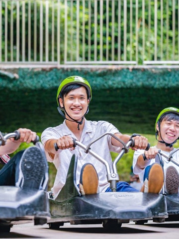 Riders enjoying the Skyline Luge Singapore experience.