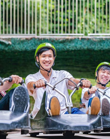 Riders enjoying the Skyline Luge Singapore experience.