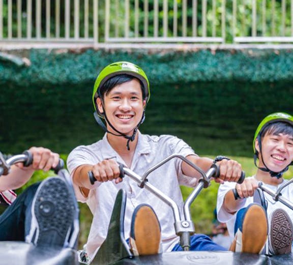 Riders enjoying the Skyline Luge Singapore experience.