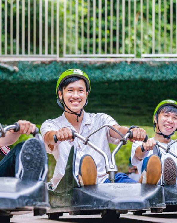 Riders enjoying the Skyline Luge Singapore experience.
