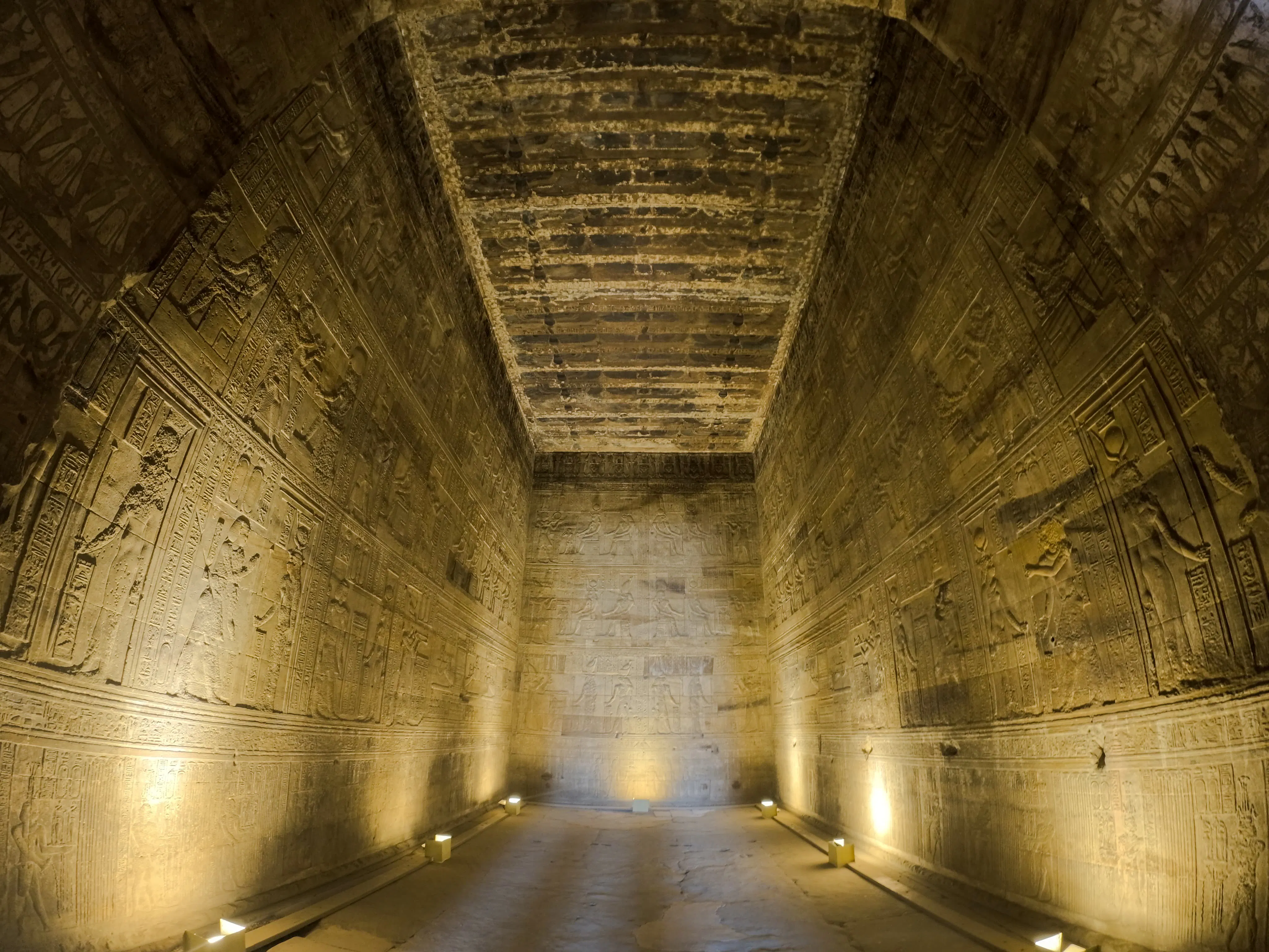 Ancient Egyptian hieroglyphs on temple walls, Aswan, part of Nile Serenade tour.
