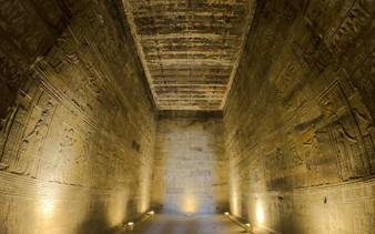 Ancient Egyptian hieroglyphs on temple walls, Aswan, part of Nile Serenade tour.