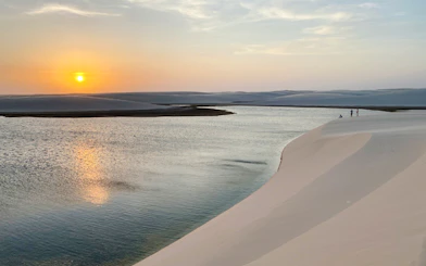 Sunset over dunes and lagoon in Atins, part of the 4x4 tour from Sao Paulo.