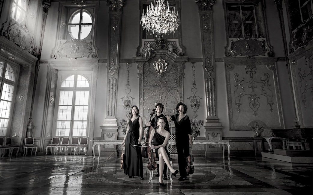 Musicians with string instruments in Mirabell Palace concert hall, Salzburg.