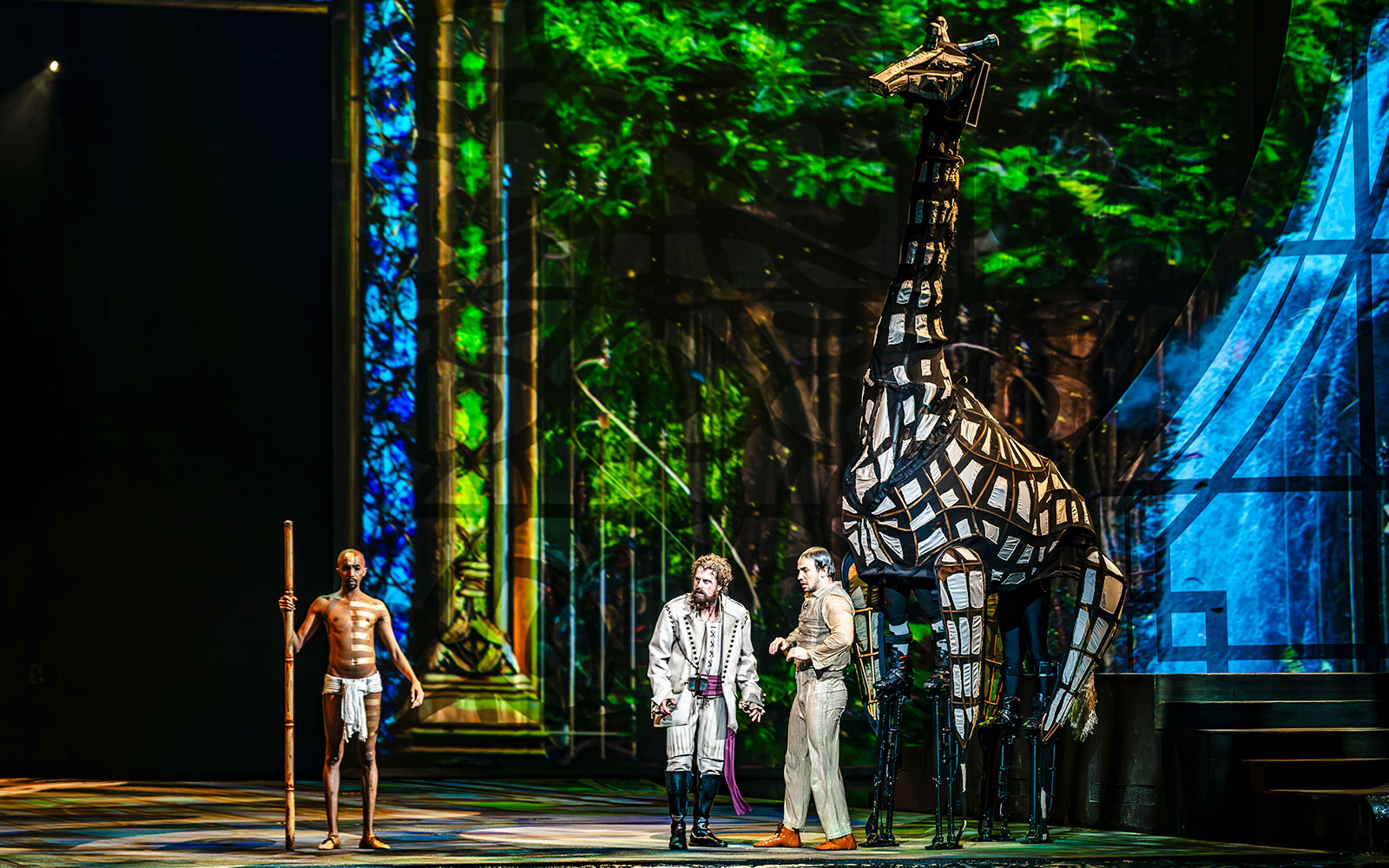 Performers with giraffe puppet during House of Dancing Water show.