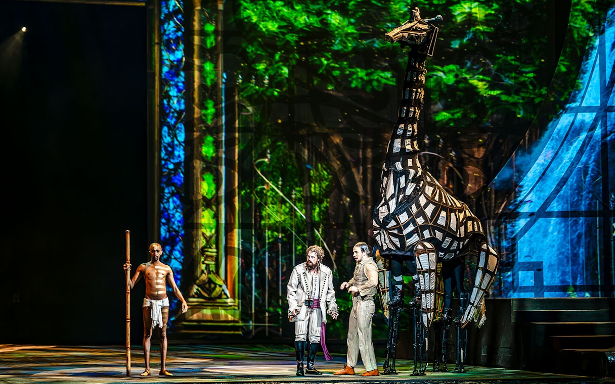 Performers with giraffe puppet during House of Dancing Water show.