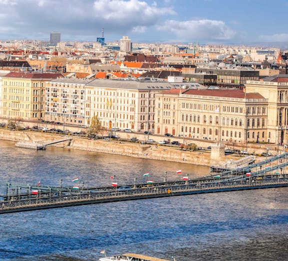 Panorama of Budapest with Chain Bridge and tourist boat on Danube River, Hungary.