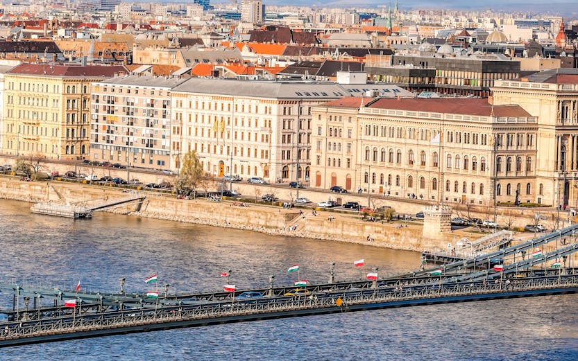 Panorama of Budapest with Chain Bridge and tourist boat on Danube River, Hungary.