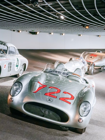 Historic Mercedes-Benz race cars on display at the Mercedes-Benz Museum.