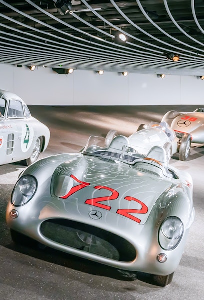 Historic Mercedes-Benz race cars on display at the Mercedes-Benz Museum.
