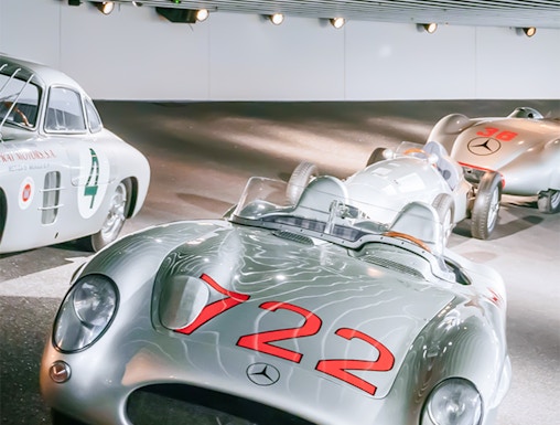 Historic Mercedes-Benz race cars on display at the Mercedes-Benz Museum.