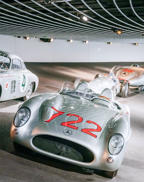 Historic Mercedes-Benz race cars on display at the Mercedes-Benz Museum.