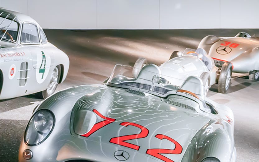Historic Mercedes-Benz race cars on display at the Mercedes-Benz Museum.