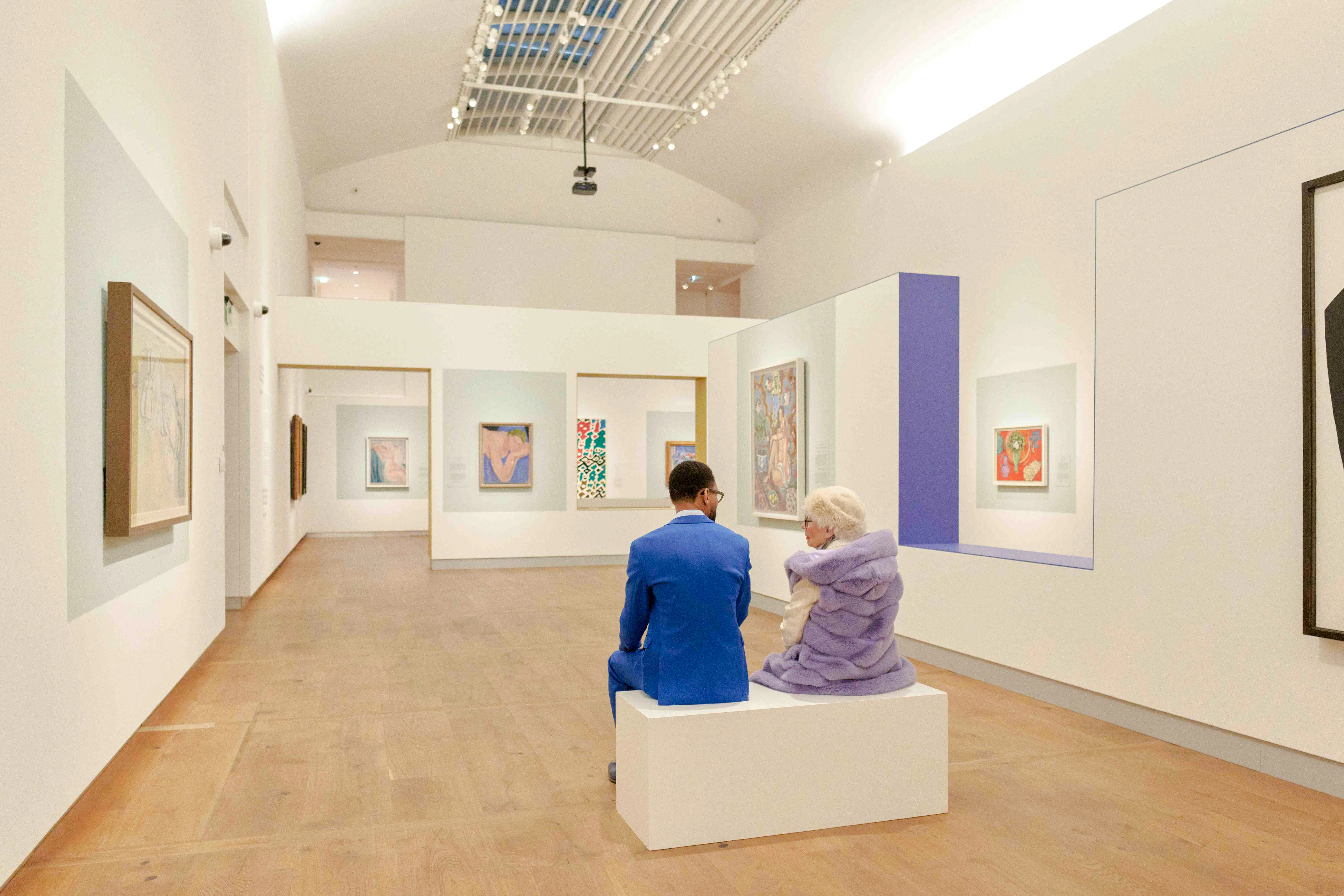Visitors seated in an art gallery at Chez Matisse, Amsterdam.