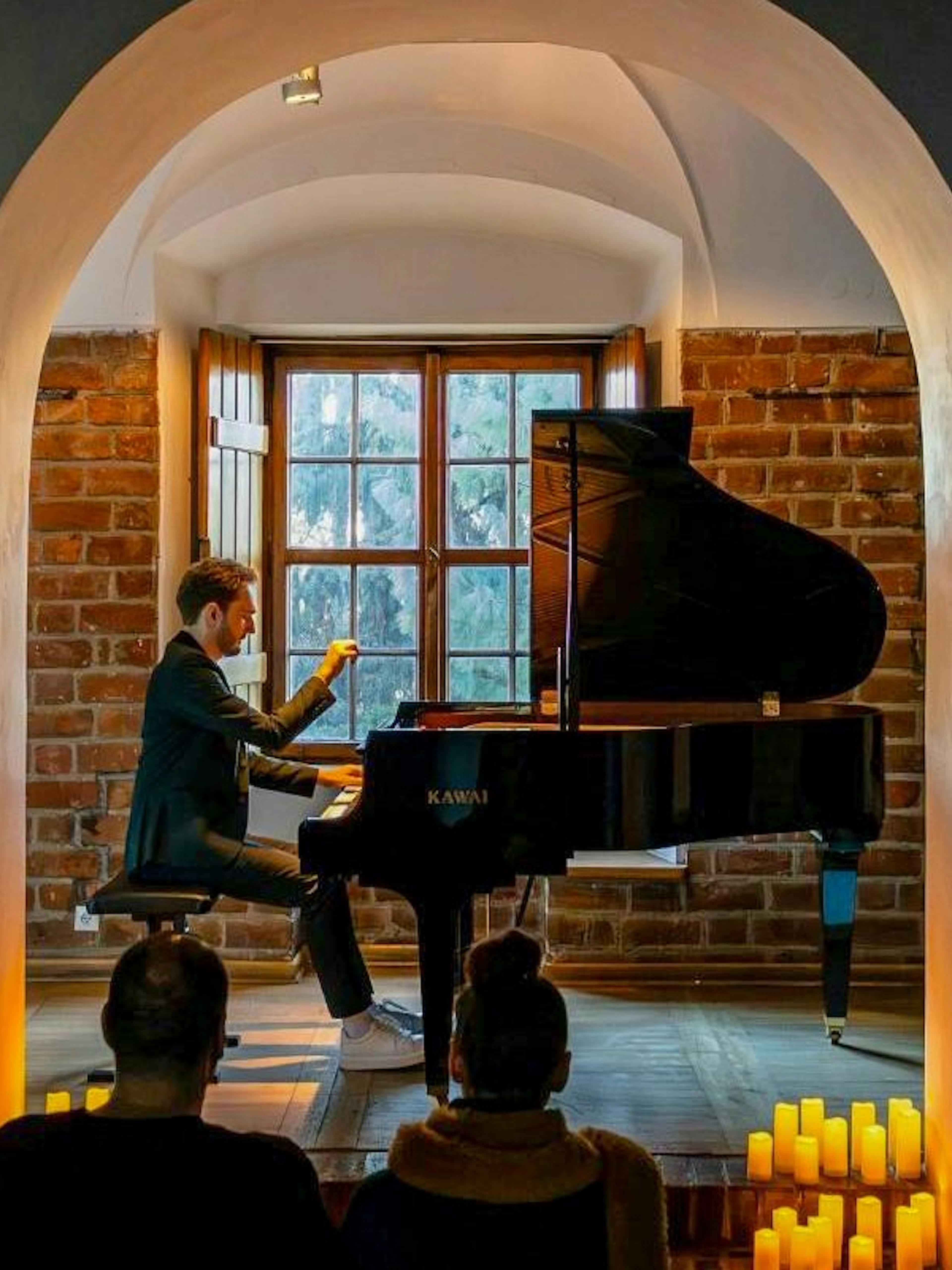 Pianist performing at Chopin Concert, Royal Castle Complex, Warsaw.